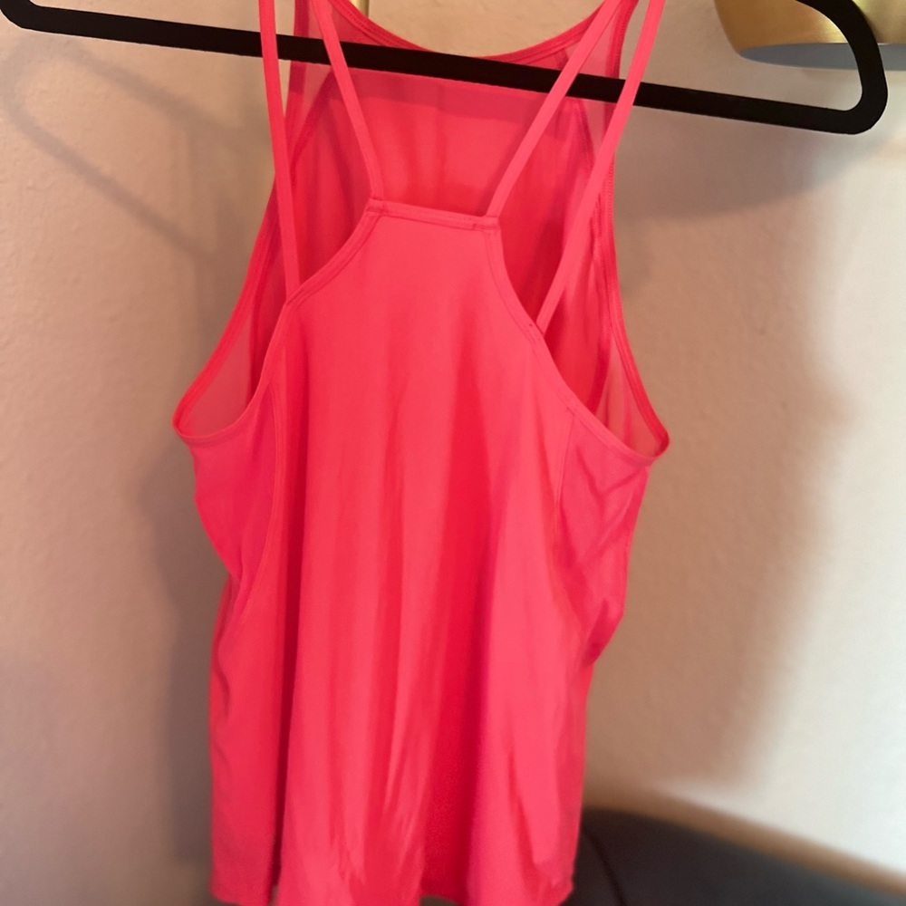 Lululemon workout top size 4.  Pink/salmon color - Picture 4 of 6